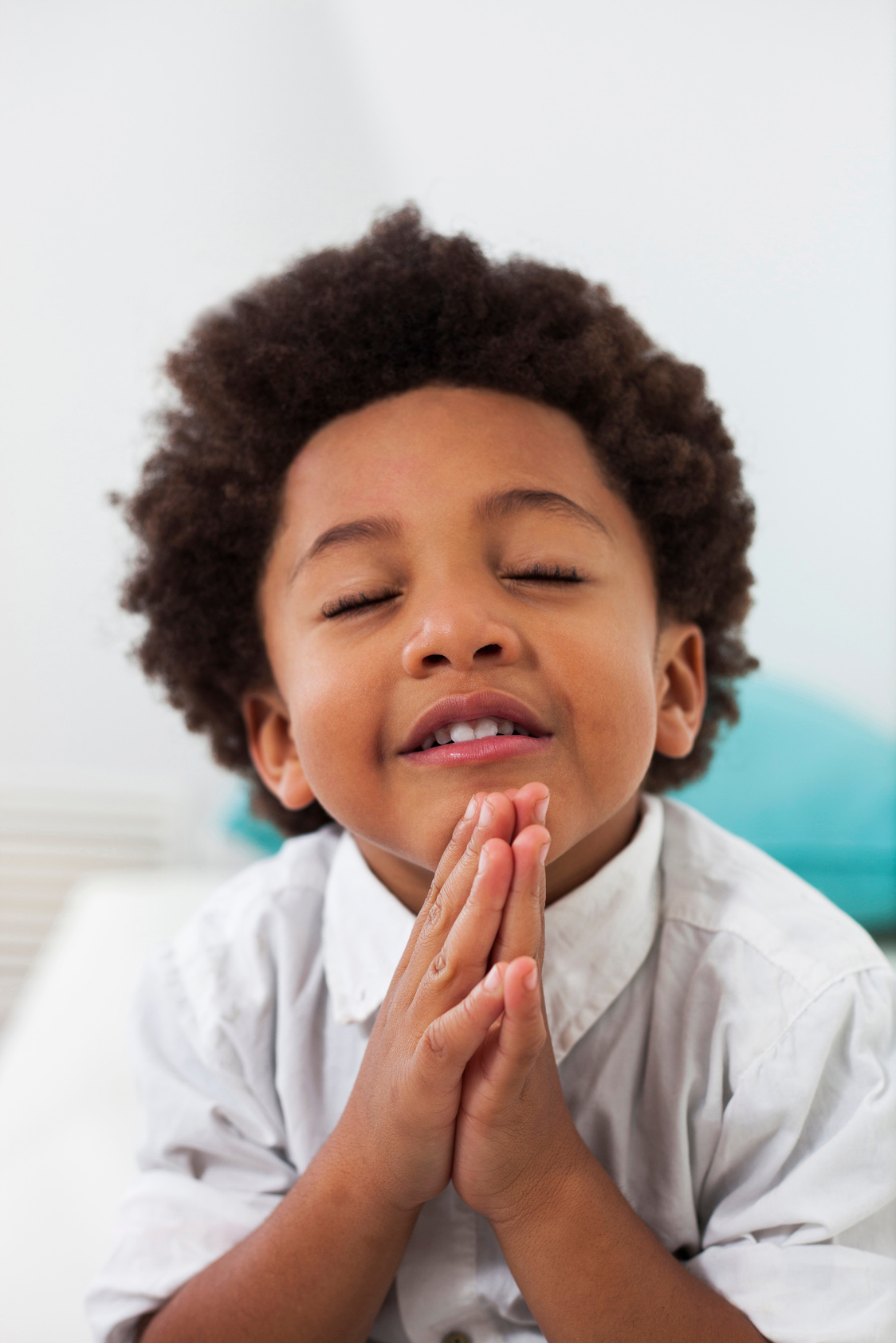 Sweet black little boy praying